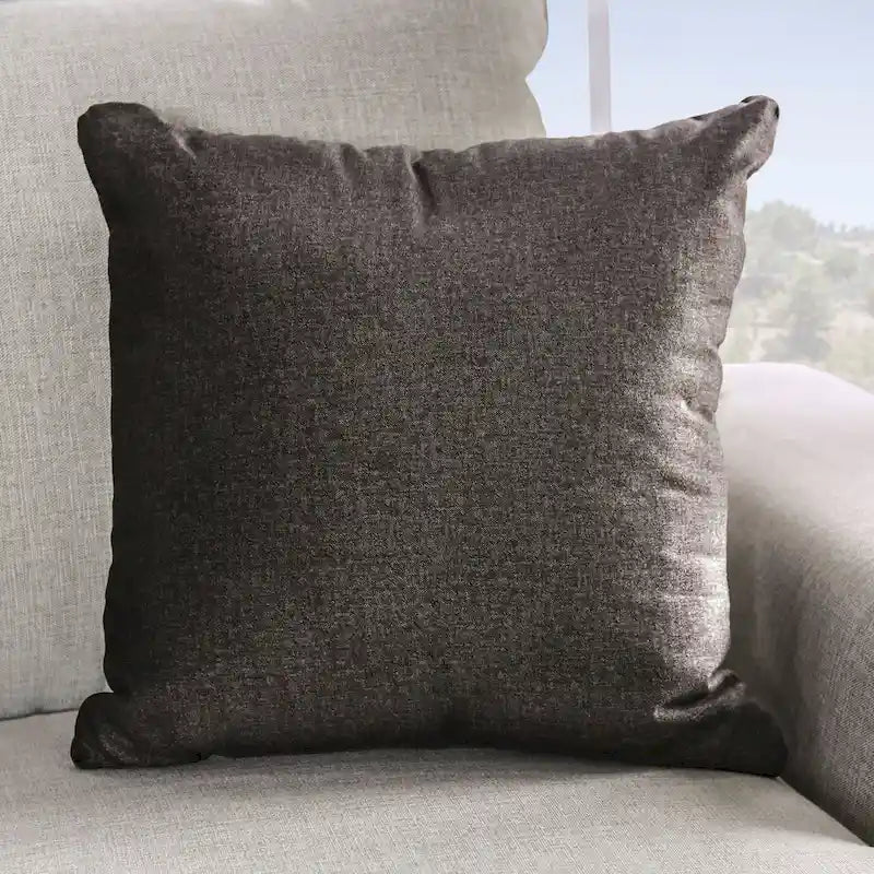Transitional-style light gray fabric sofa, featuring nailhead trim and throw pillows
