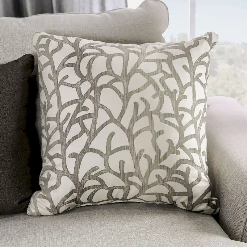 Transitional-style light gray fabric sofa, featuring nailhead trim and throw pillows