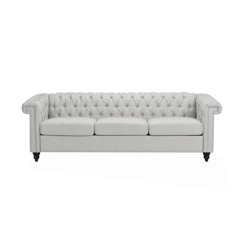 Szara sofa Chesterfield z pikowaniem w guziki