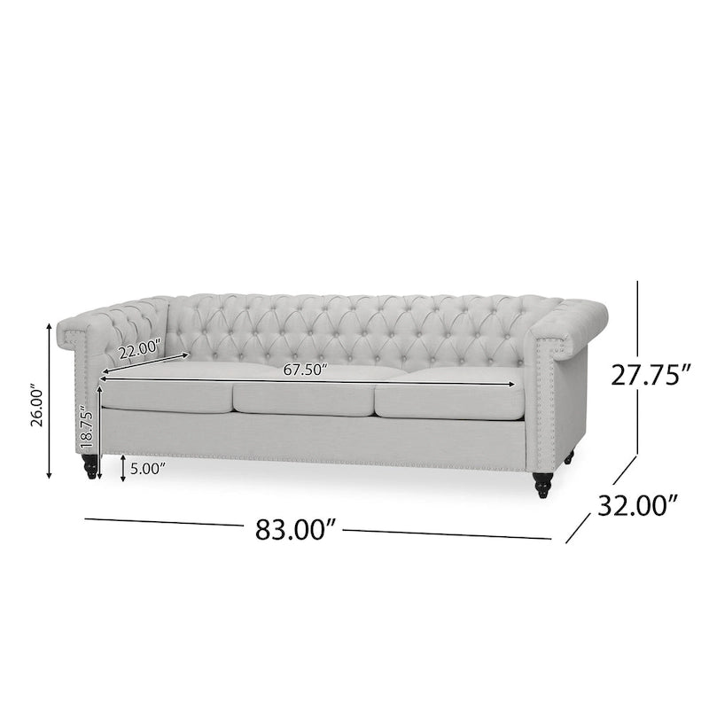 Szara sofa Chesterfield z pikowaniem w guziki