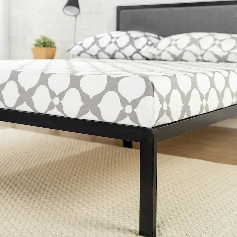 Black steel platform bed frame (with a grey fabric headboard)